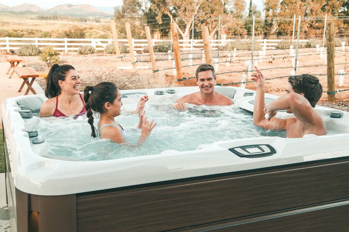 optima model - family in 6 person hot tub